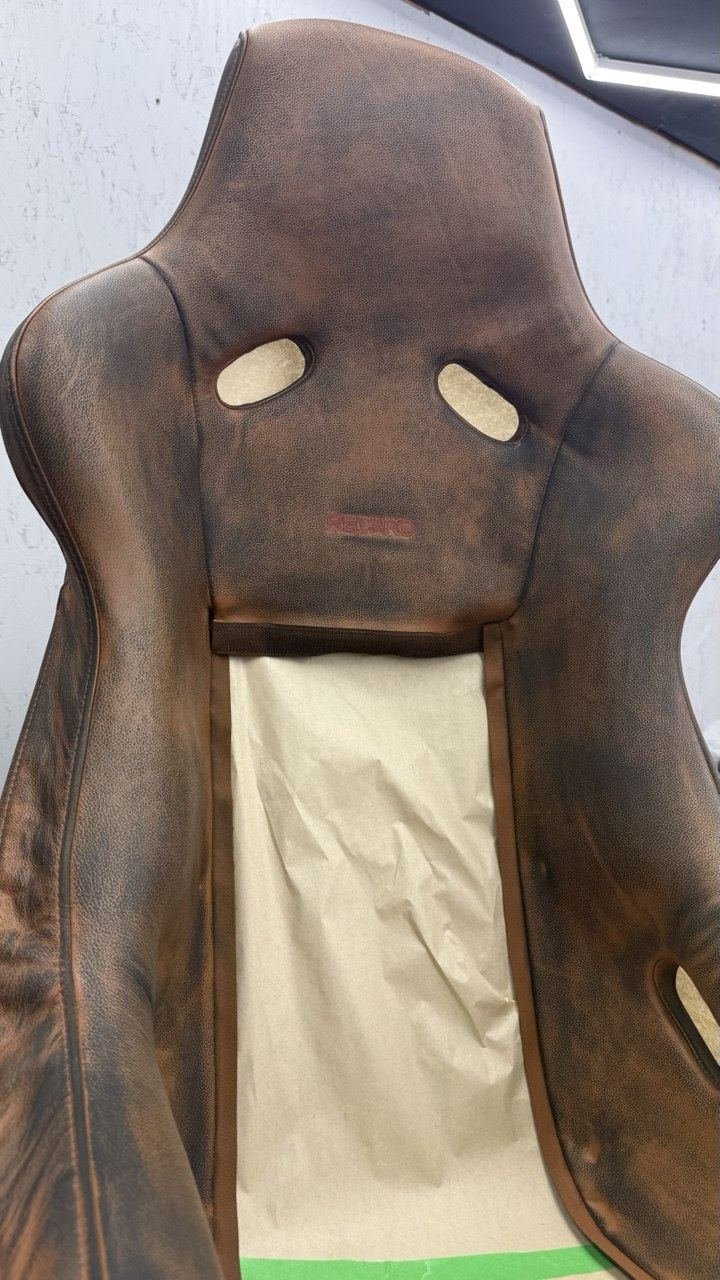 Racing seat stripped and masked off before colour