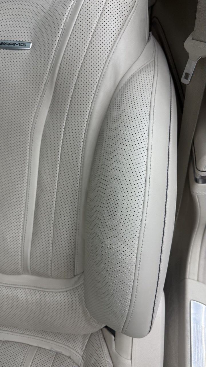 Cream perforated seat, repaired