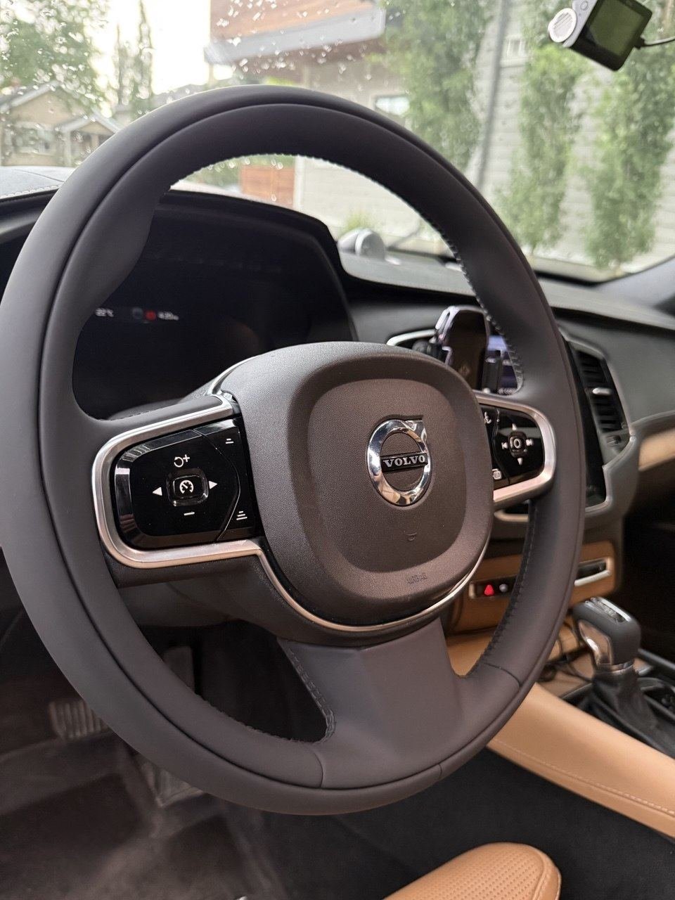 A Volvo steering wheel, reupholstered in black leather