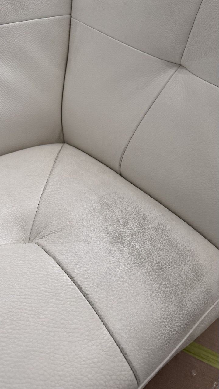White sectional corner with grey wear marks on the seat