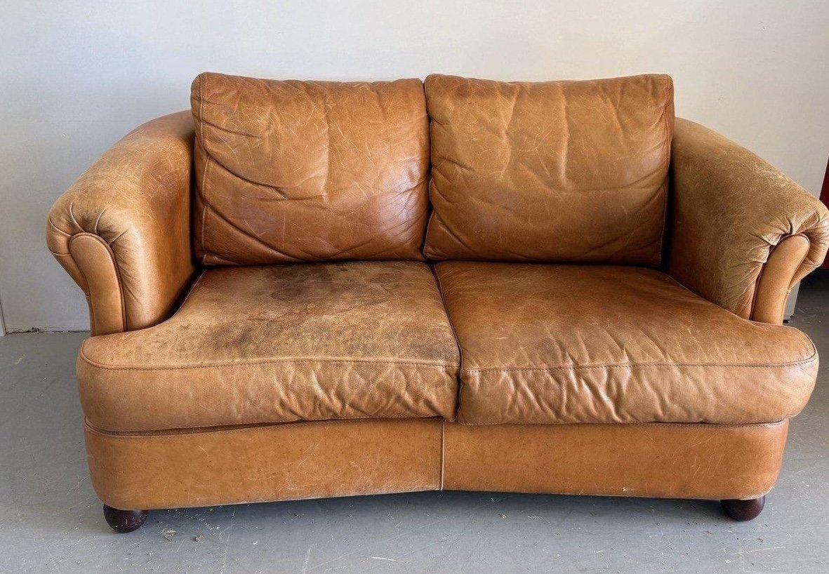 Cognac loveseat before work, cropped to match the after photo