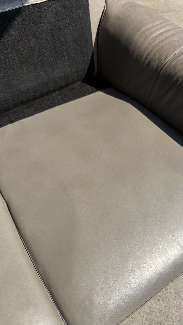 The same grey armchair seat, finish rebuilt