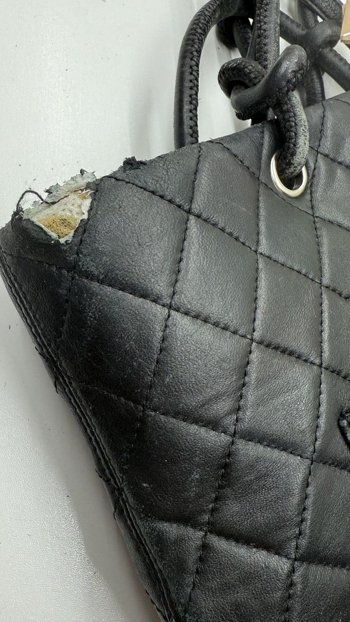 Quilted leather bag, damaged corner before repair