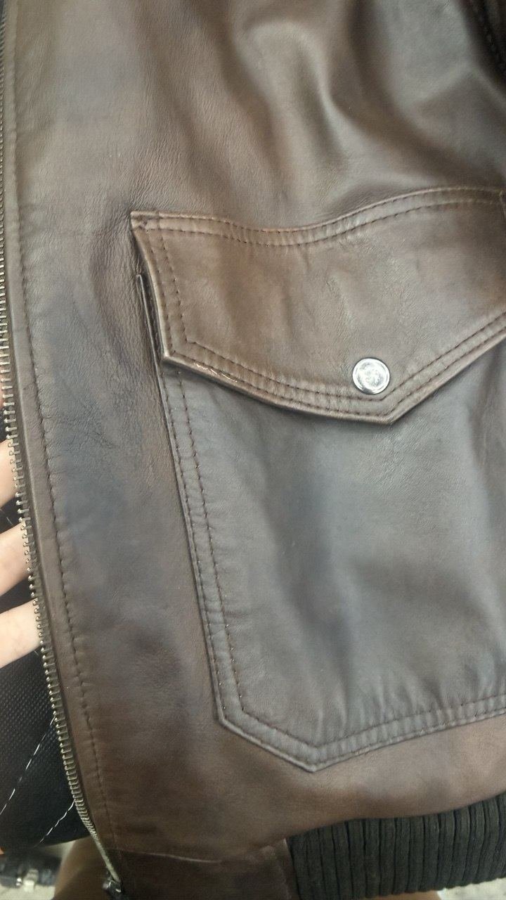 Brown leather jacket pocket after restoration