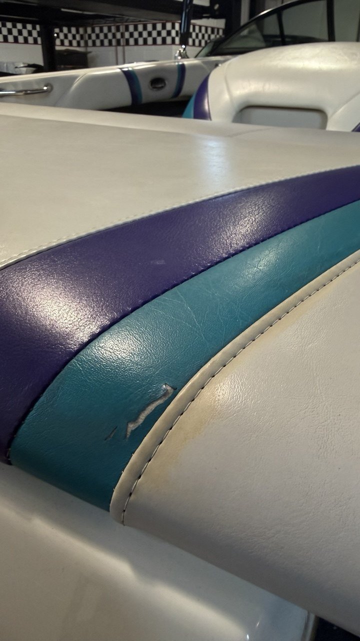 Marine vinyl bolster, torn through the colour panel