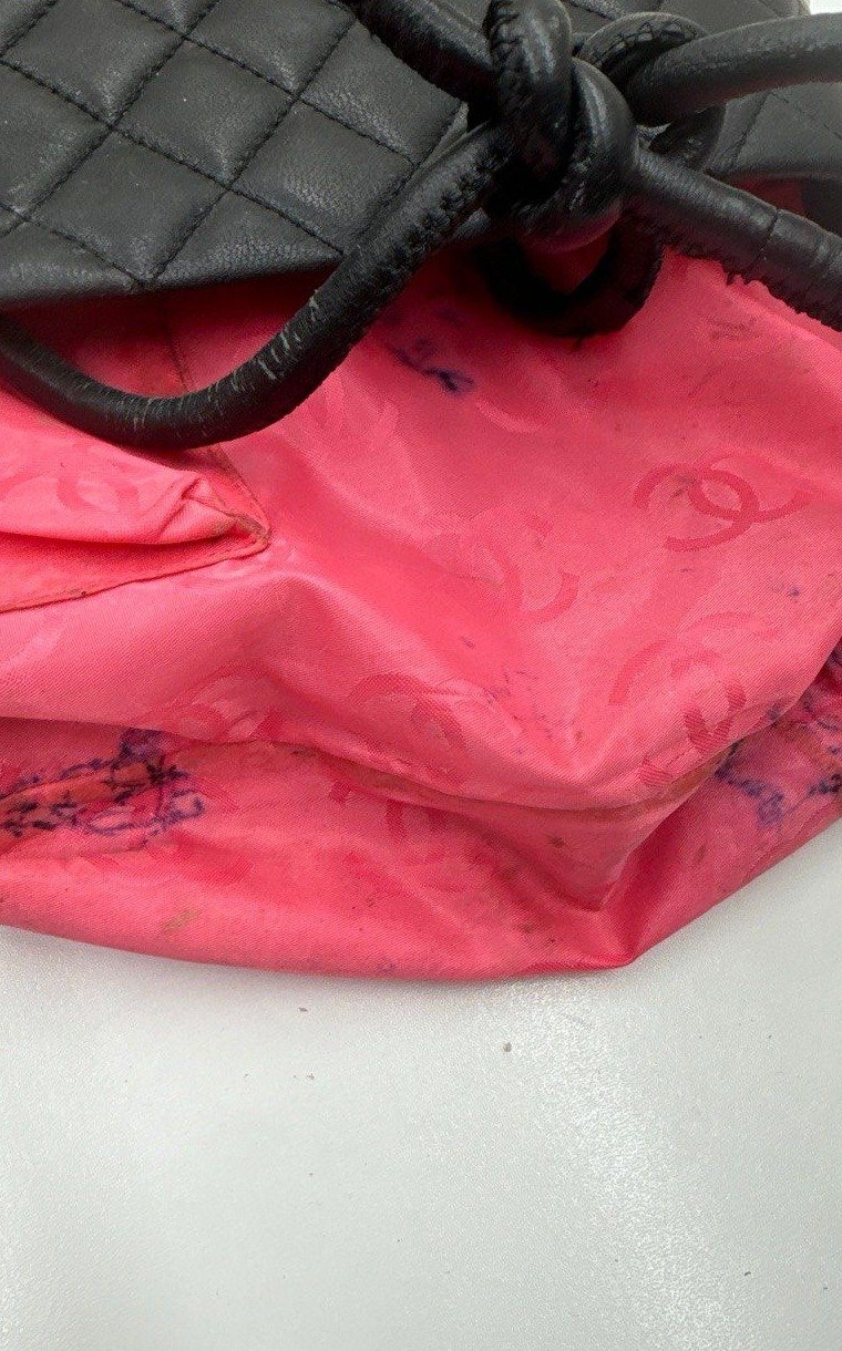 Quilted bag with ink marks on the lining, cropped to match the after photo